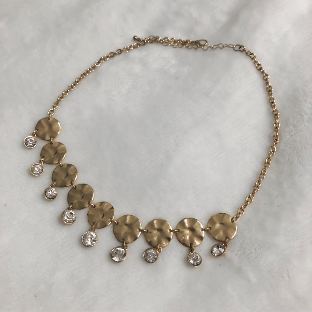 A gold and fake diamond necklace